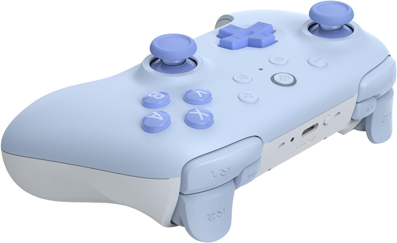 Light blue gaming controller with buttons and joysticks.