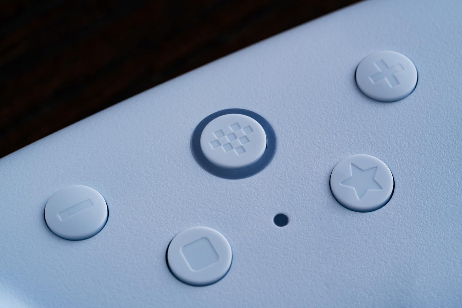 Close-up of a white game controller buttons.