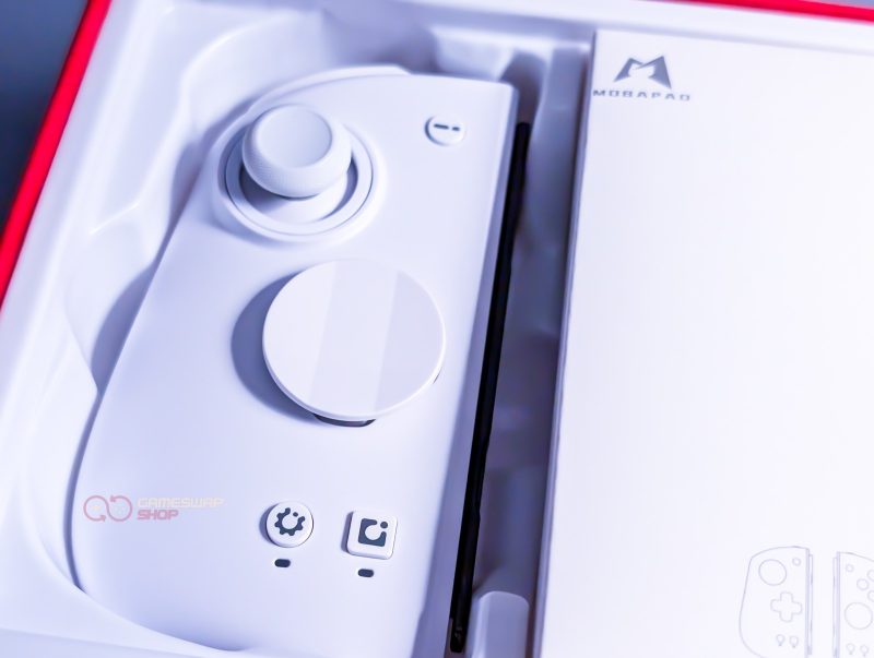White gaming controller in packaging
