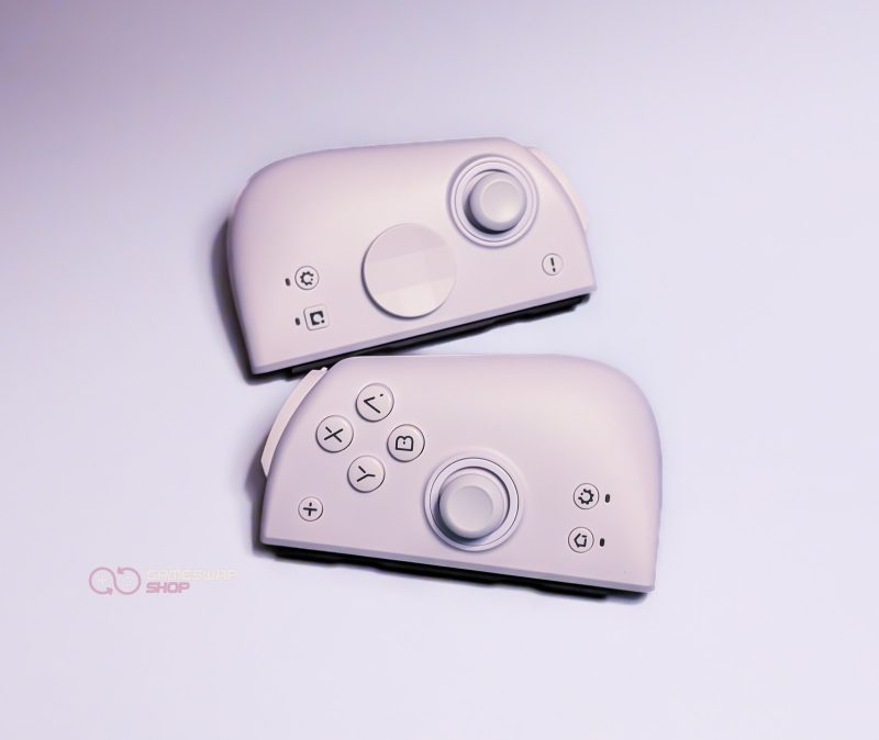 White detachable gaming controller on light background.