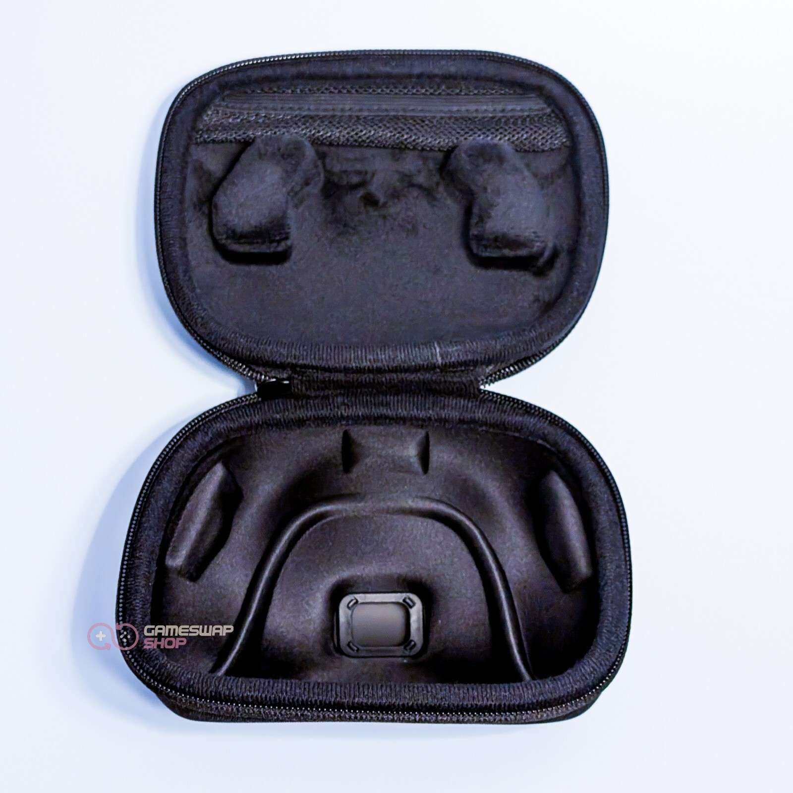 Black foam carrying case with compartments.
