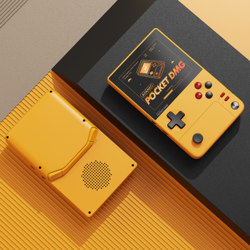 Yellow retro handheld gaming consoles on table.