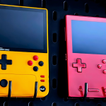 Yellow and red handheld gaming devices on display.